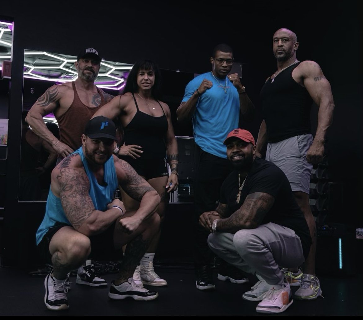 Group of fitness professionals together in a training facility