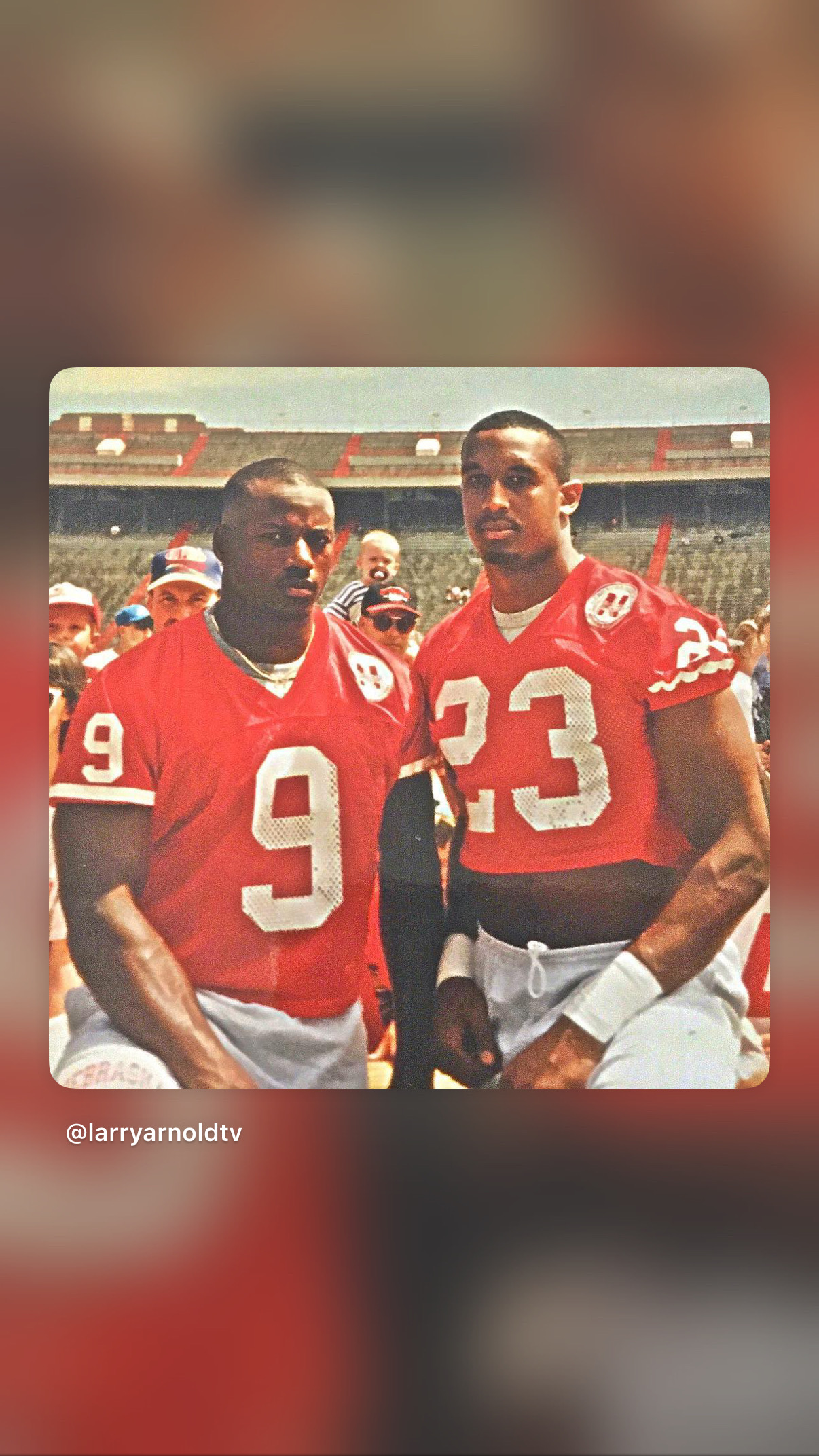 Larry Arnold wearing Nebraska number 23 alongside a teammate